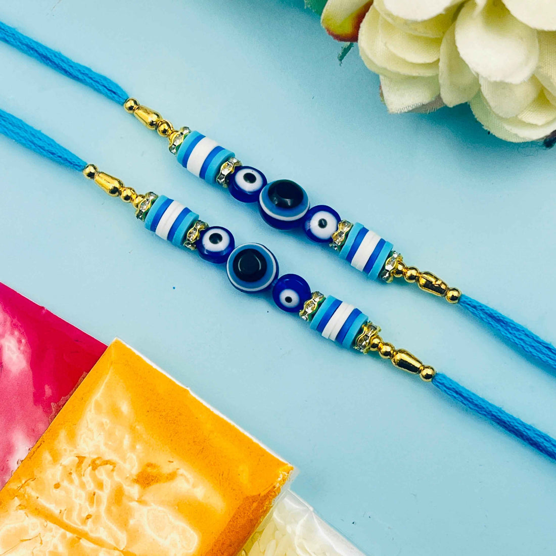Blue Striped Beaded Nazar Rakhi with Roli Chawal Set of 2