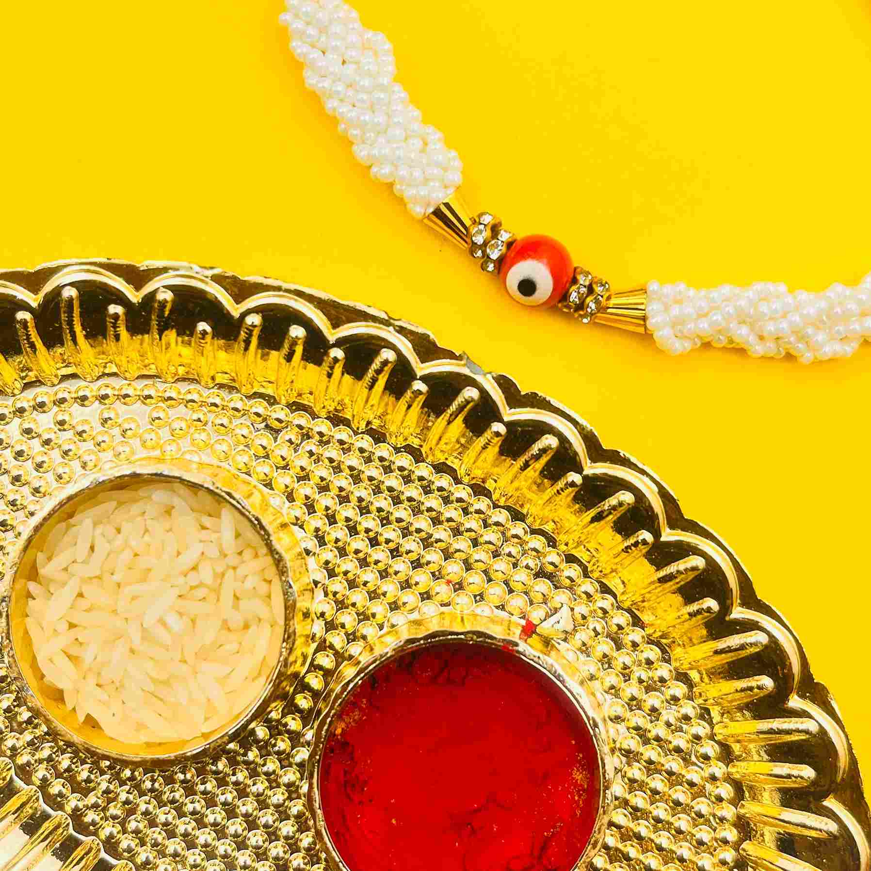 Handmade Evil Eye Rakhi with White Pearl Beads – Protective Rakhi Thread for Brother with Tilak Thali