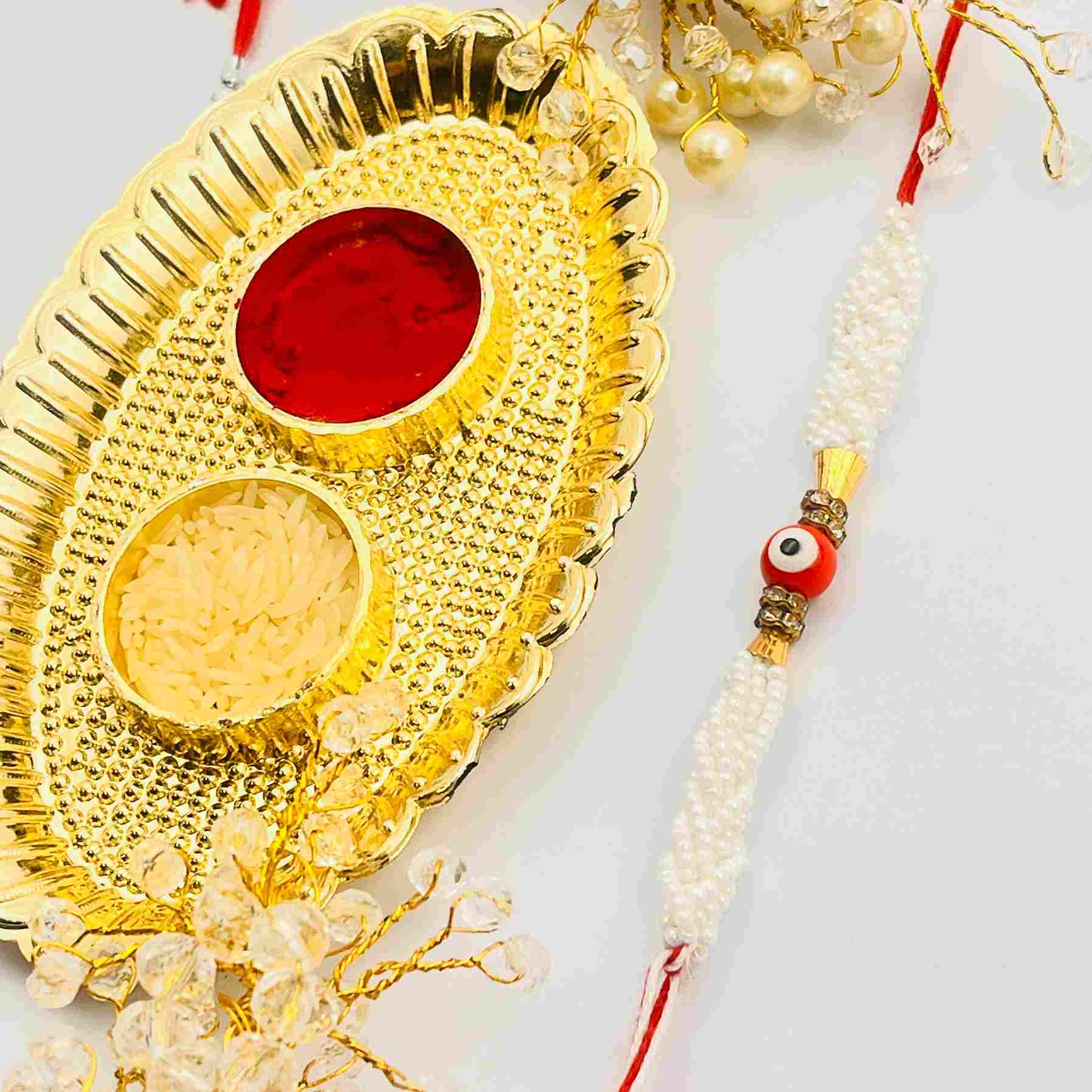 Handmade Evil Eye Rakhi with White Pearl Beads – Protective Rakhi Thread for Brother with Tilak Thali