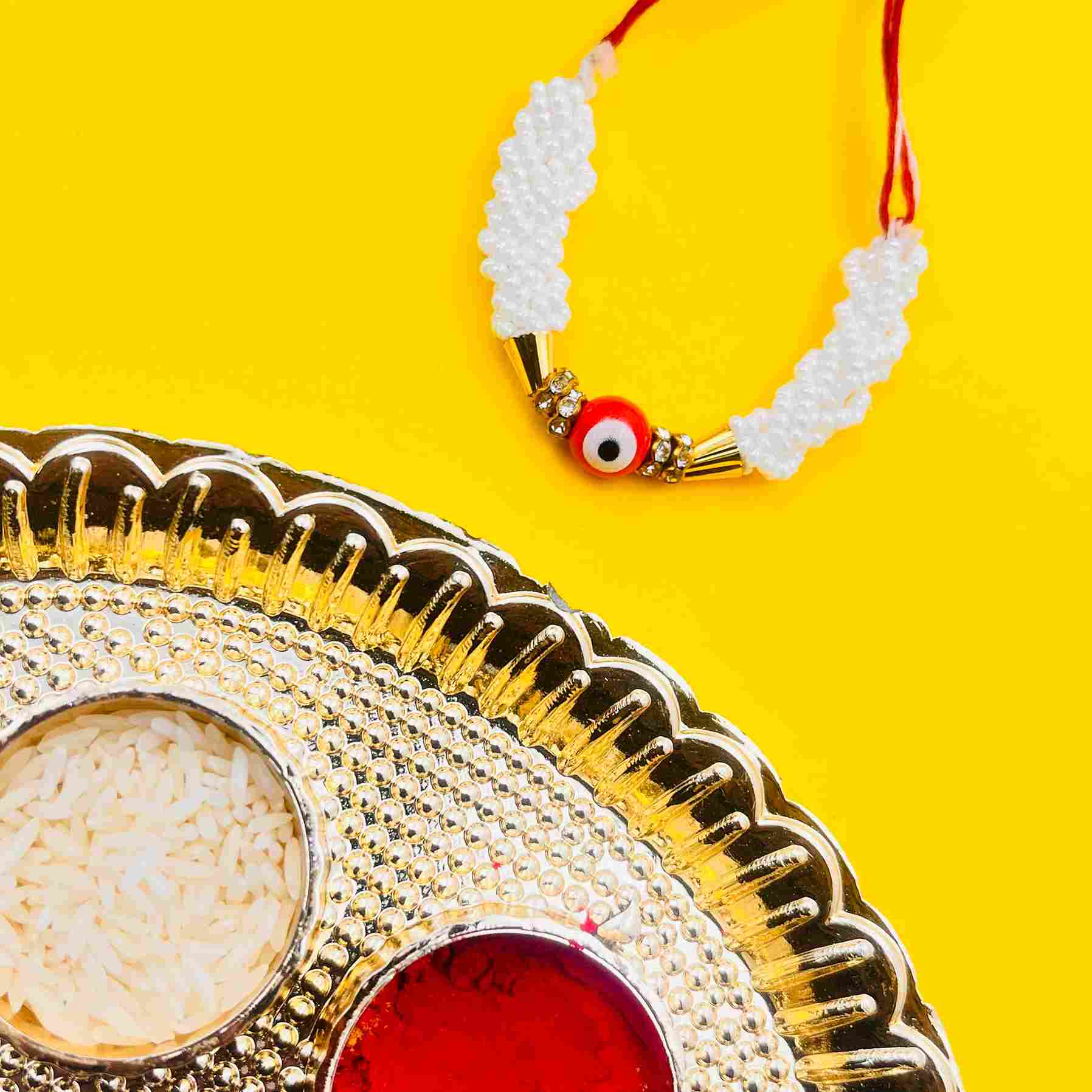 Handmade Evil Eye Rakhi with White Pearl Beads – Protective Rakhi Thread for Brother with Tilak Thali