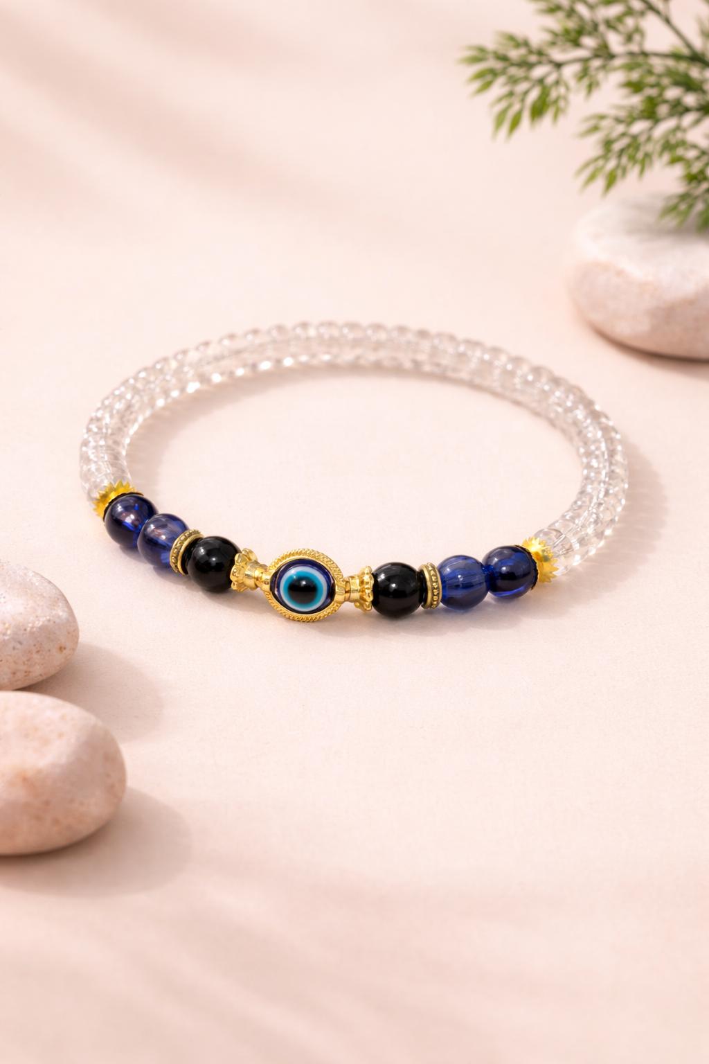 Blue evil eye beaded bracelet with transparent beads and gold accents for daily wear