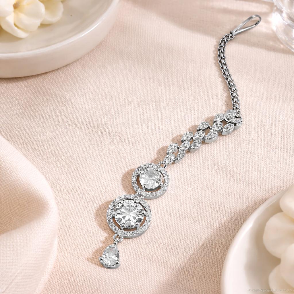 Elegant silver AD tikka with layered chain and stone detailing for women