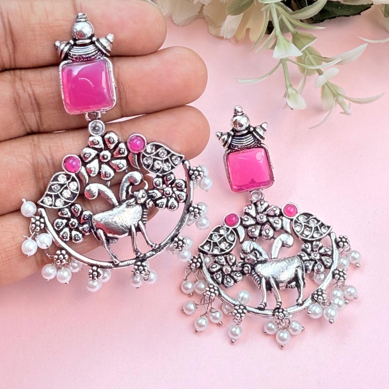 Ethnic deer design earrings with pink stone top and pearl cluster drop