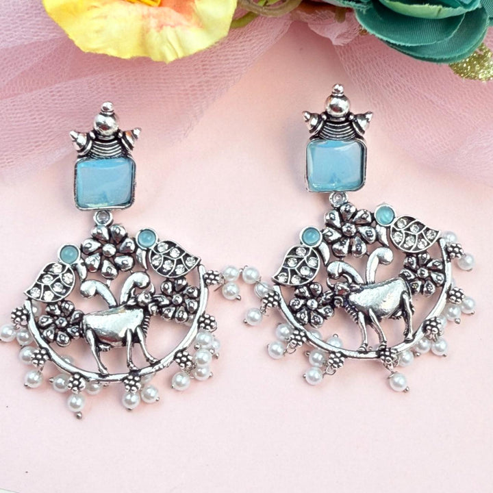Handcrafted oxidised silver statement earrings with deer design pearls and blue stone perfect for festive ethnic styling