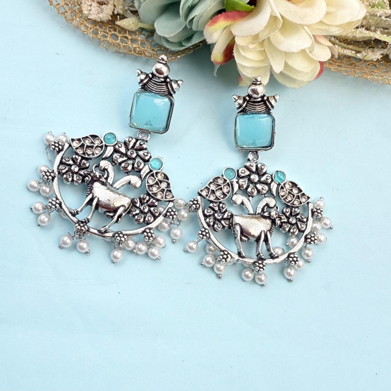 Oxidised silver deer motif earrings with blue stone and pearl drops traditional jhumka style for festive and wedding wear India