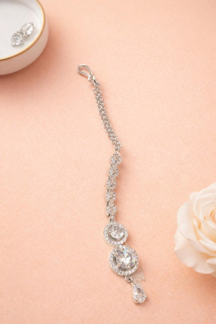 Silver AD drop maangtika with round stone design for women festive wear