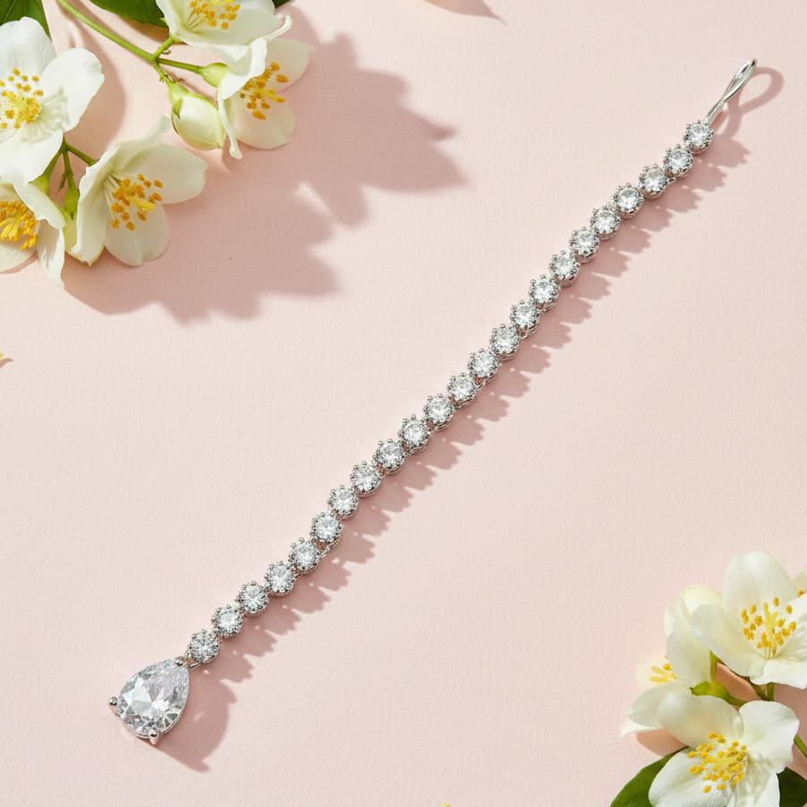 Elegant silver tone maang tikka with AD stones and white drop design for festive wear
