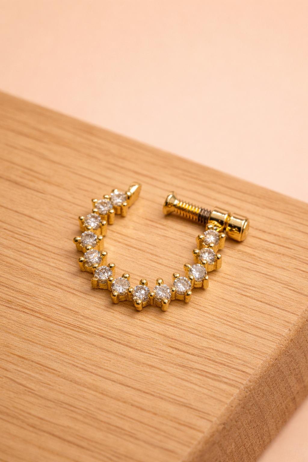 Traditional gold tone nose pin with stone setting screw back design